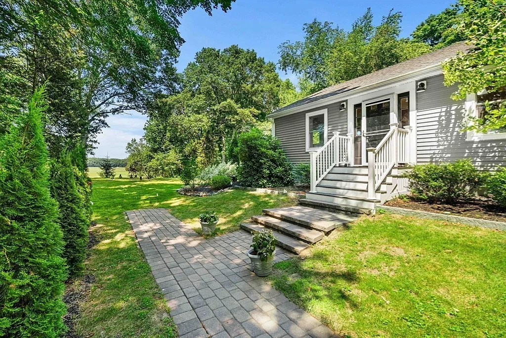 Paver walkway leading to the covered front entry