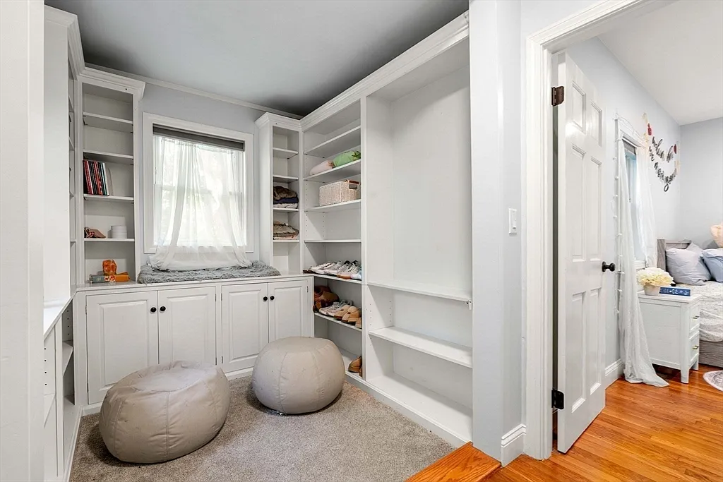 Built-in shelving and window seat in the bedroom nook